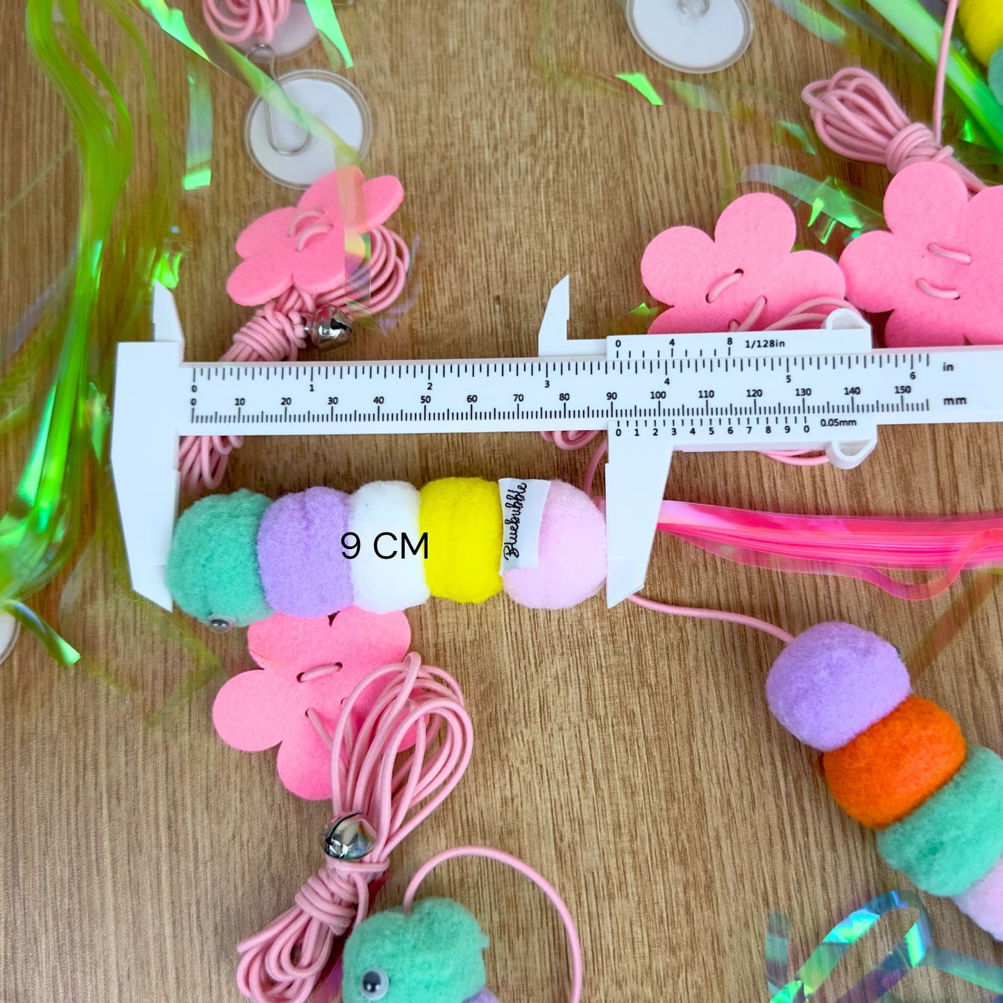 Caterpillar Feather Balls with Bell